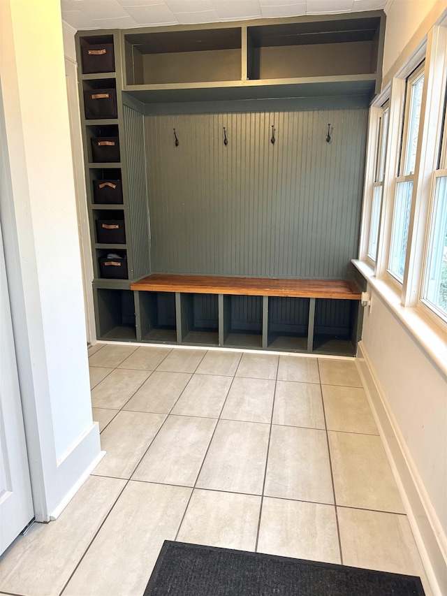 mudroom with baseboards and light tile patterned floors