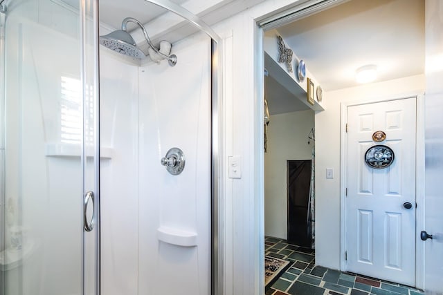 bathroom with a shower stall