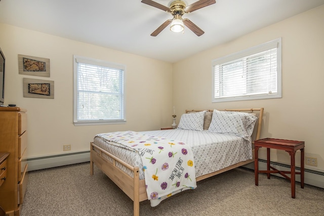 carpeted bedroom with a baseboard radiator, baseboard heating, and a ceiling fan