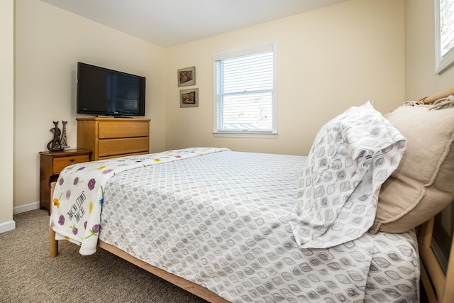 carpeted bedroom with baseboards
