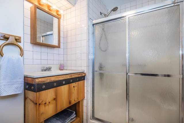 50 Rosewood Ln, Castleton, VT 05732 - full bathroom with tile walls, a shower with door, backsplash, and vanity