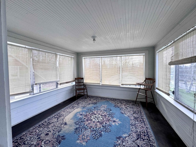 unfurnished sunroom with wooden ceiling and wood finished floors