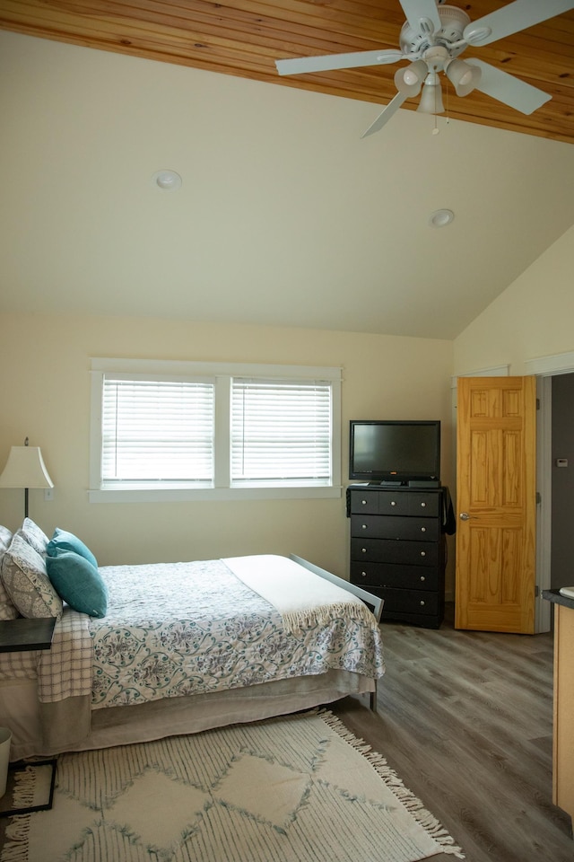 bedroom with recessed lighting, ceiling fan, vaulted ceiling, and wood finished floors