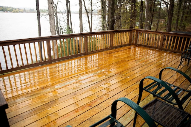 wooden deck with a water view