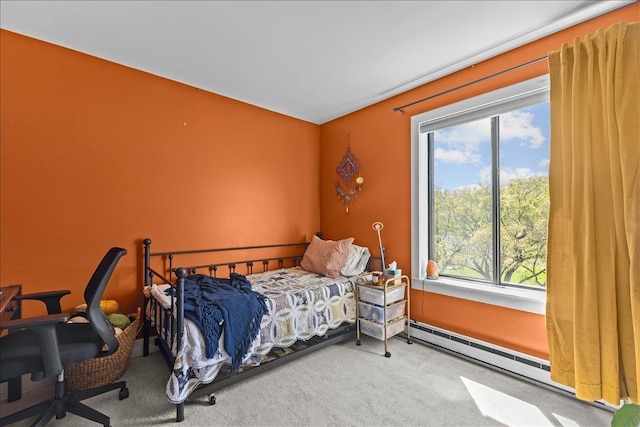 carpeted bedroom featuring a baseboard radiator and multiple windows