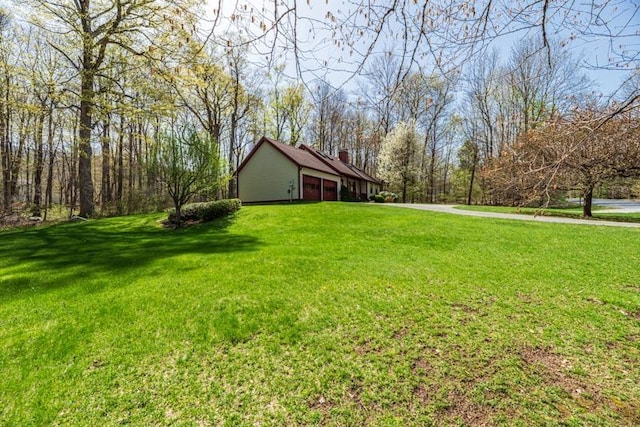 view of yard with a garage