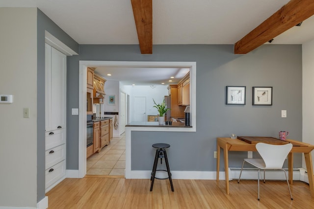 kitchen with baseboard heating, recessed lighting, a peninsula, light wood-type flooring, and beamed ceiling