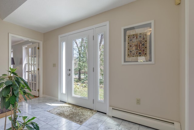 doorway to outside featuring a baseboard radiator, marble finish floor, and a wealth of natural light