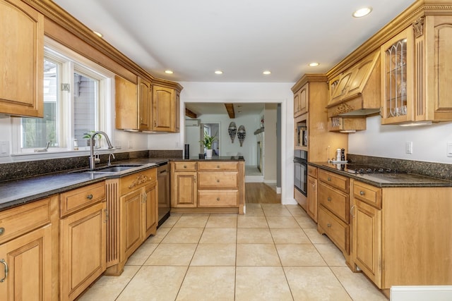 kitchen featuring a peninsula, glass insert cabinets, recessed lighting, a sink, and black appliances