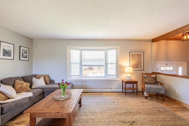 living room with a textured ceiling and wood finished floors