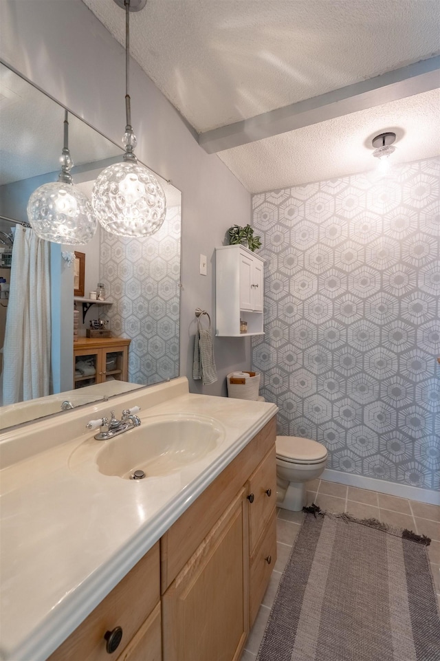 bathroom with a textured ceiling, toilet, a shower with shower curtain, tile patterned floors, and vanity