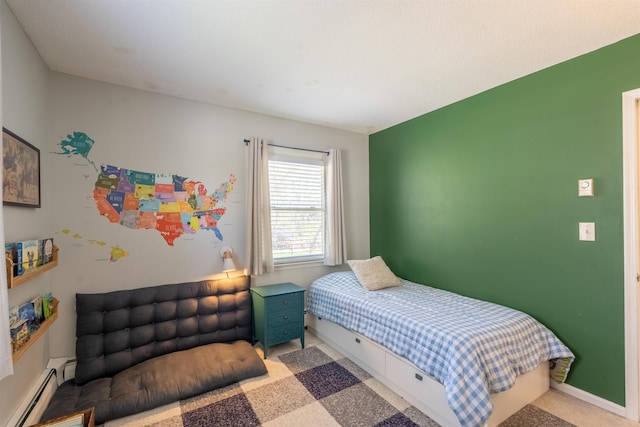 bedroom with carpet flooring and baseboard heating