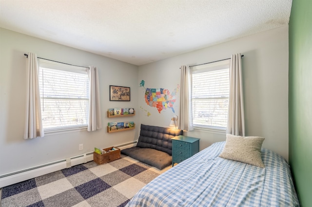 bedroom with multiple windows and baseboard heating