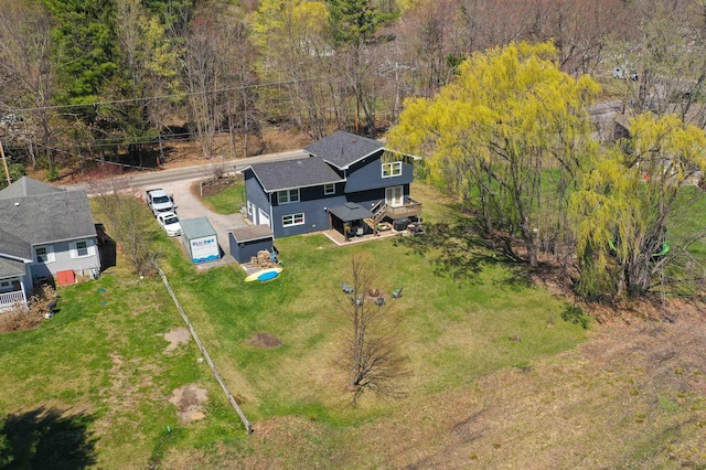 drone / aerial view featuring a view of trees
