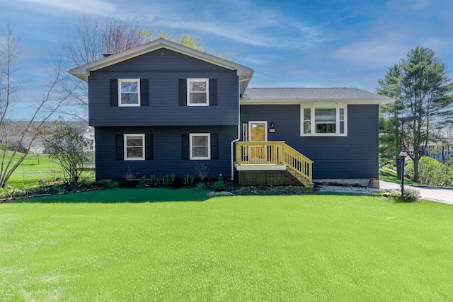 tri-level home with a front yard