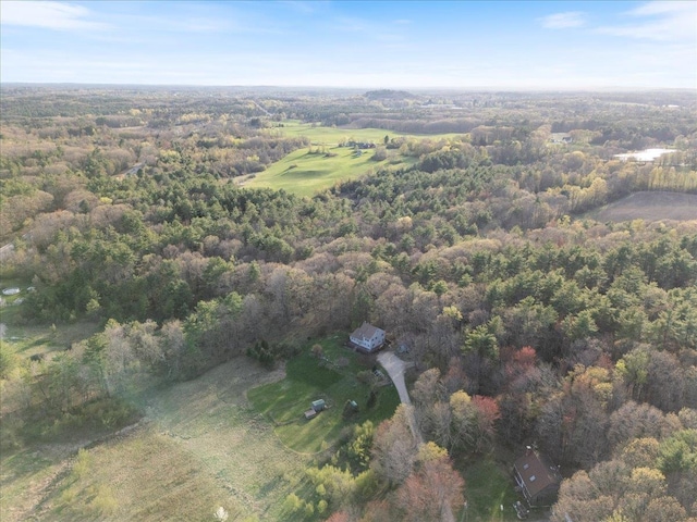 birds eye view of property featuring a forest view