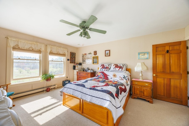 bedroom featuring light colored carpet, baseboard heating, and ceiling fan