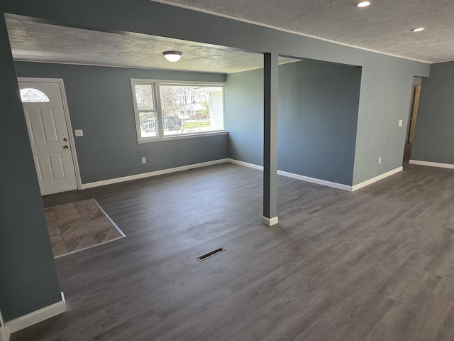 39 Gail St, Winooski, VT 05404 - entrance foyer with a textured ceiling, visible vents, and baseboards