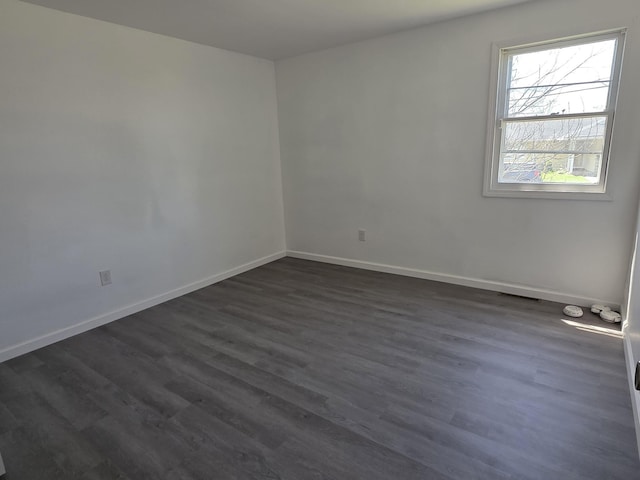 39 Gail St, Winooski, VT 05404 - spare room with dark wood-style flooring and baseboards