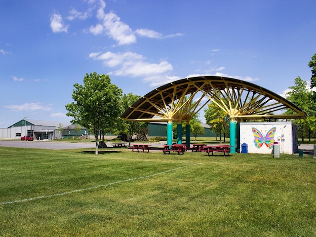 surrounding community featuring a gazebo and a lawn