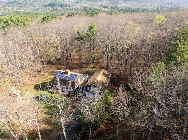 drone / aerial view featuring a view of trees
