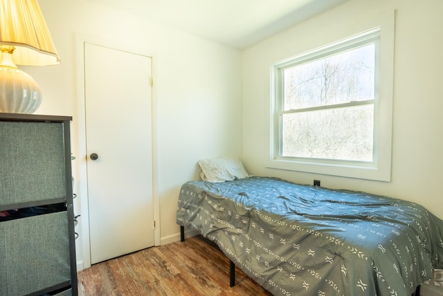 bedroom with wood finished floors
