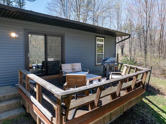 deck featuring an outdoor hangout area and a grill