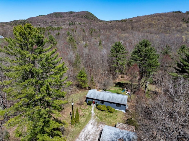 aerial view with a mountain view and a view of trees