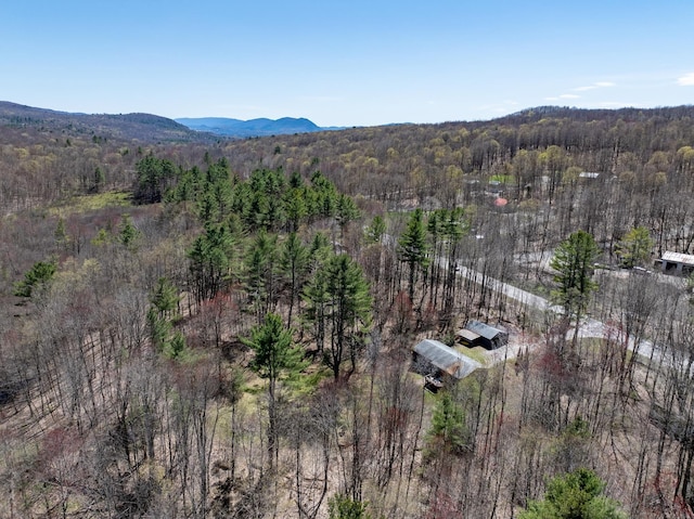 bird's eye view featuring a view of trees and a mountain view