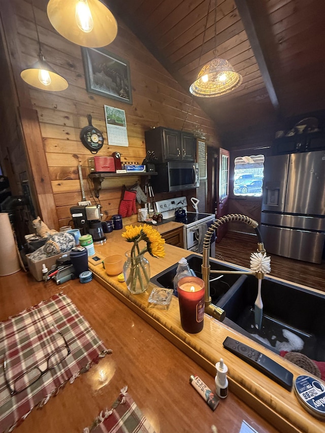 1781 Jersey St S, Addison, VT 05491 - kitchen with appliances with stainless steel finishes, vaulted ceiling, wood finished floors, wooden walls, and wood ceiling
