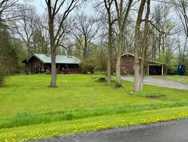 1781 Jersey St S, Addison, VT 05491 - view of grassy yard featuring dirt driveway, an outbuilding, and a detached carport