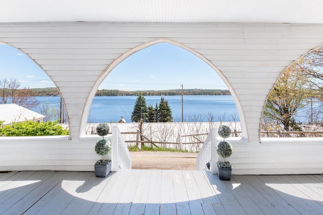wooden deck featuring a water view
