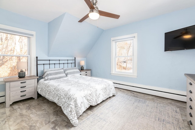 bedroom with vaulted ceiling, a ceiling fan, multiple windows, and a baseboard heating unit