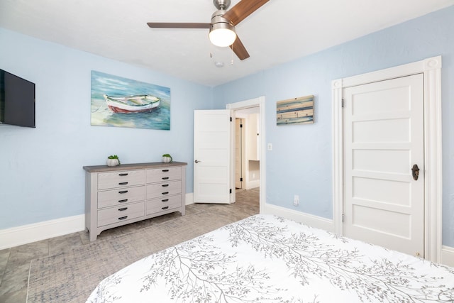 bedroom with baseboards and a ceiling fan
