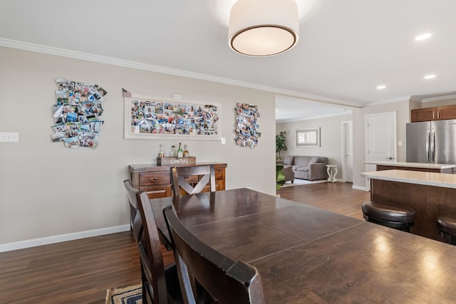 dining room with ornamental molding, baseboards, recessed lighting, and dark wood finished floors