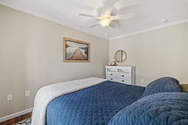bedroom with ornamental molding, baseboards, a ceiling fan, and wood finished floors
