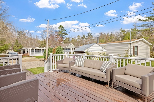 wooden terrace with outdoor lounge area