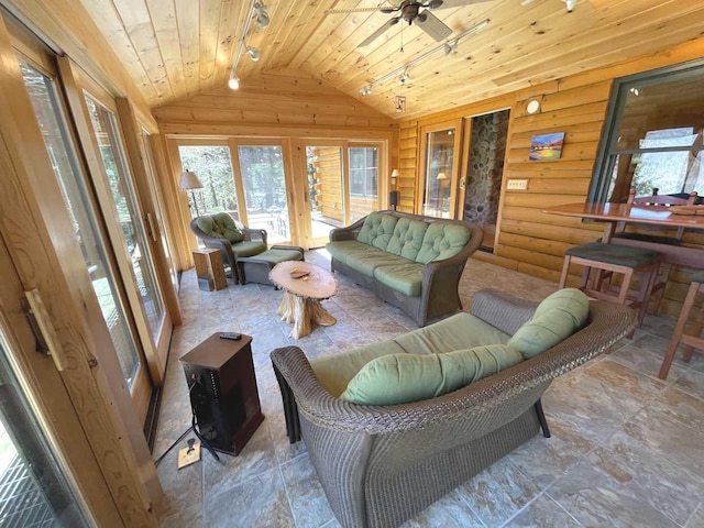 living area with wooden ceiling, lofted ceiling, a wealth of natural light, and track lighting