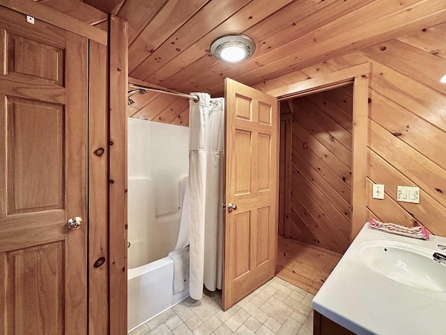 full bath featuring wooden ceiling, vanity, wooden walls, and shower / bath combination with curtain
