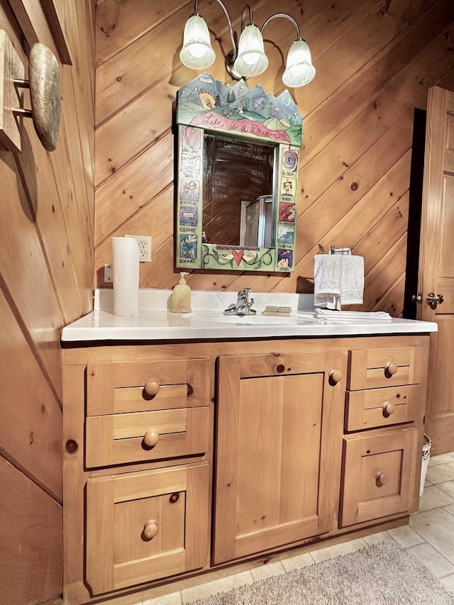bathroom with wood walls and vanity