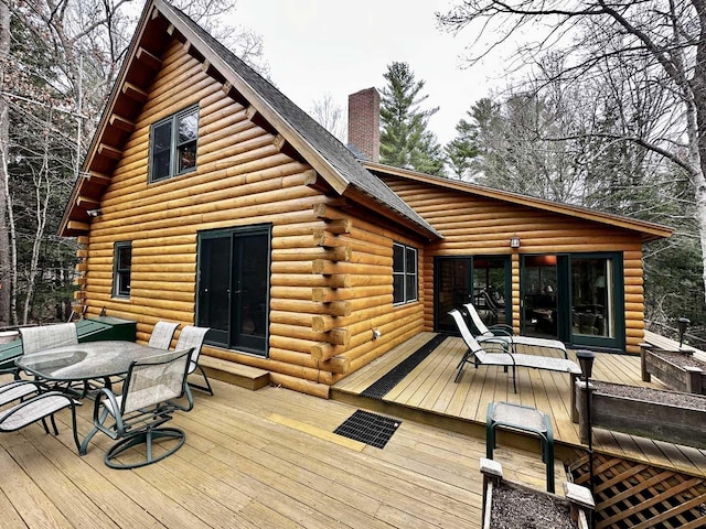 deck with outdoor dining space