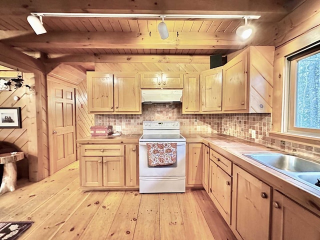 kitchen featuring tile countertops, white electric stove, light brown cabinets, and under cabinet range hood