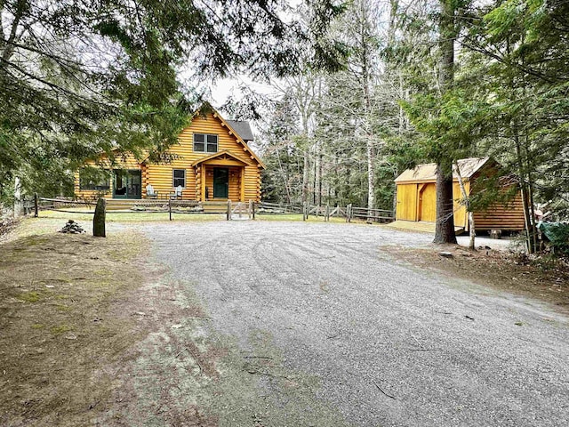exterior space with fence and log siding