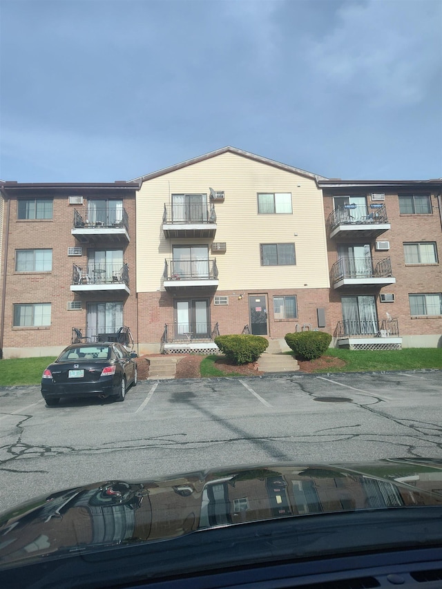 124 Mammoth Rd Unit 206, Hooksett, NH 03106 - view of apartment building / complex featuring uncovered parking