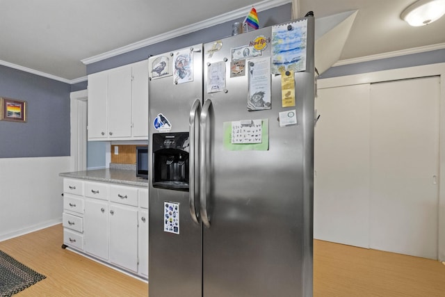 kitchen featuring light wood-type flooring, stainless steel refrigerator with ice dispenser, crown molding, light countertops, and white cabinets