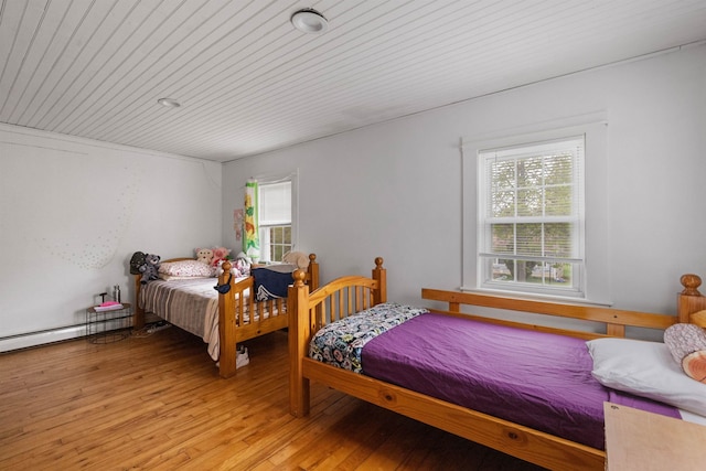 bedroom with wooden ceiling and light wood-style floors