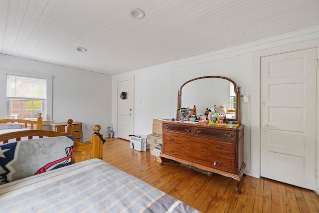 bedroom featuring wood ceiling and wood-type flooring