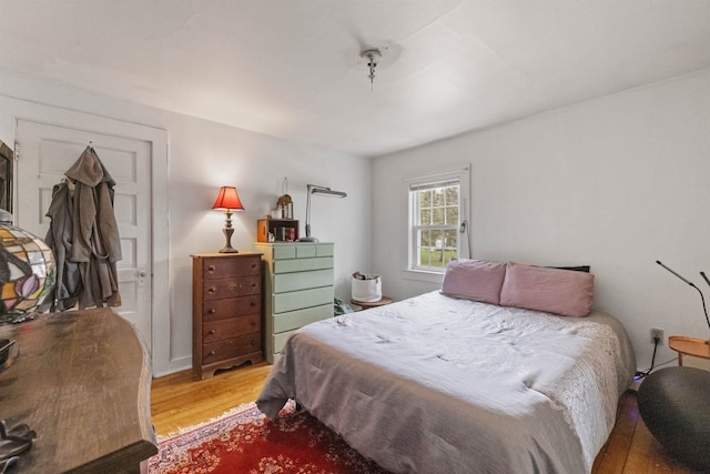 bedroom featuring light wood-style flooring