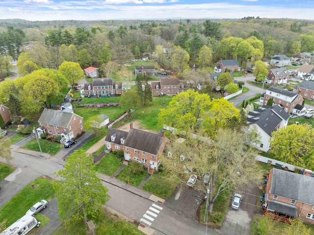 bird's eye view featuring a forest view and a residential view