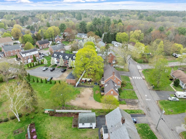 birds eye view of property with a residential view and a view of trees